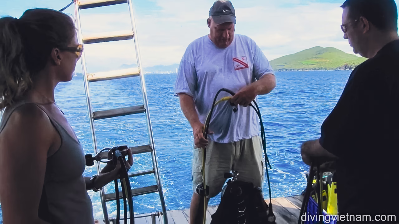 Preparing scuba gear on boat Open Water Diver Course
